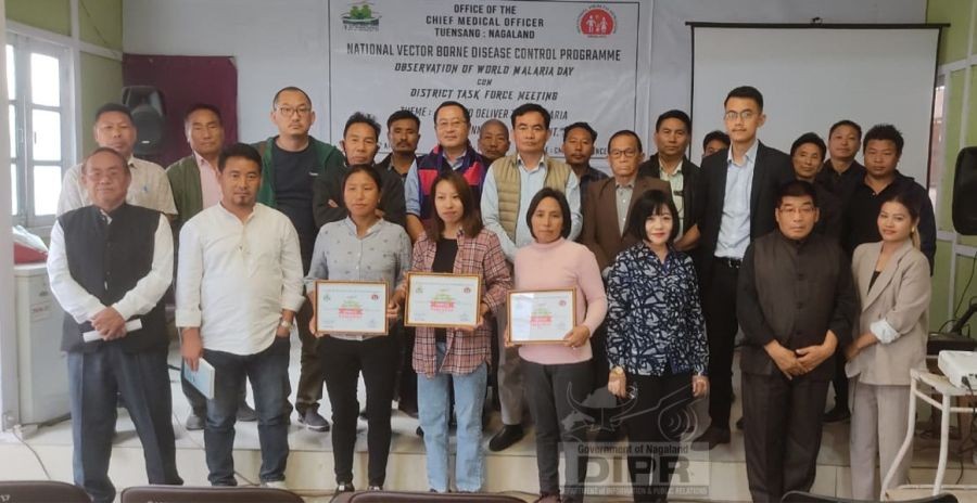 DC Tuensang along with staff of CMO and best ASHA awardees on April 25. (DIPR Photo)